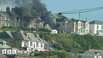 Fire starts in parked car and spreads to campervan