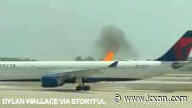 Engine of Delta aircraft carrying 282 passengers catches fire at Orlando airport, video shows