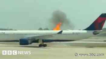 Passengers evacuate Delta plane after engine fire
