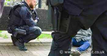 Armed police arrest man for throwing items onto major Bristol road