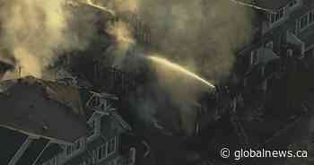 Homes damaged, residents displaced after fire starts in vehicle at Langley townhouse complex