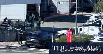 Man arrested after woman struck by car thief outside Melbourne hospital