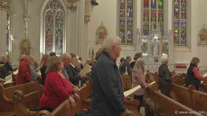 Residents mourn Pope Francis during mass at St. Joseph Cathedral