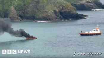 Man abandons boat after it catches fire