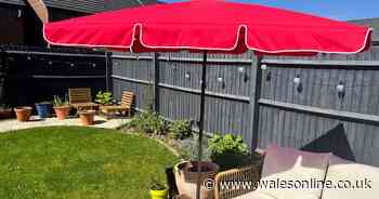 My new build patio was transformed with Dunelm's bright red parasol
