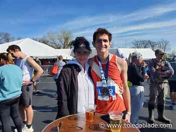 Well wishers help push marathon runners to finish line