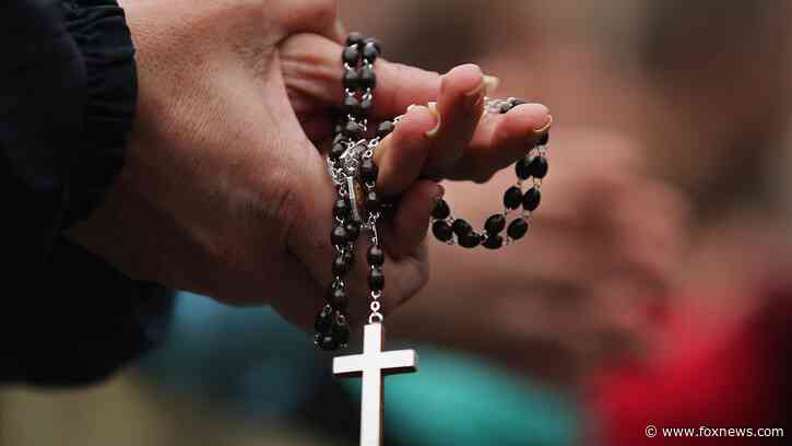 Catholic aid group violated gay employee's rights, judge says, after spouse's health benefits canceled