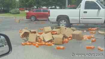 Boxes of orange soda spill on major Baton Rouge intersection