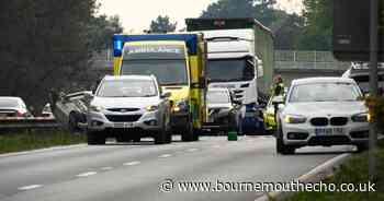 Police investigate crash that left car on its roof on A31