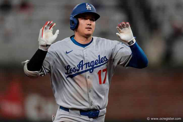 Dodgers wait out rain, extend winning streak to 7 games