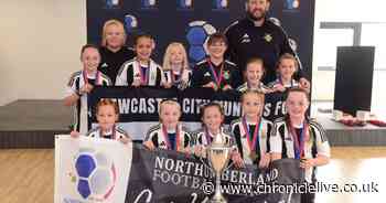 Newcastle City Juniors girls football team celebrates double cup success