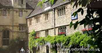 Students strolling in leafy college quad winning photo
