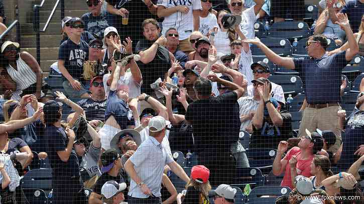 Dad goes viral after catching ball at Yankees game while daughter covers his eyes