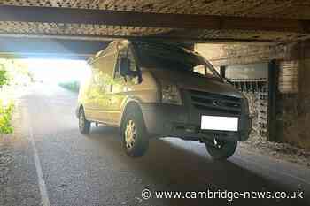 Driver flees across fields after van gets stuck under Cambridgeshire railway bridge
