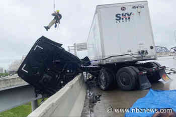 Kentucky firefighters make daring rescue to save truck dangling on overpass