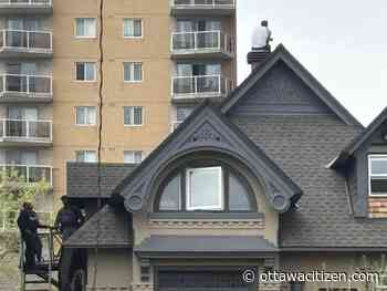Man arrested after hours long perch on downtown Ottawa roof
