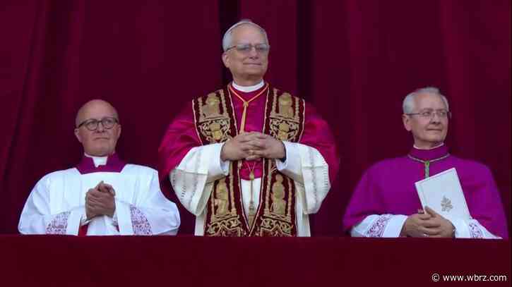 A new pope has been chosen as white smoke rises from the Sistine Chapel