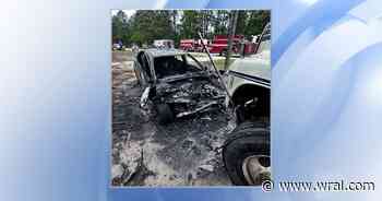 One dead after car hits dump truck and catches fire in Cameron