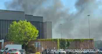 Huge fire engulfs cars outside north London shopping centre