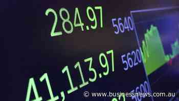 Wall St closes near flat with focus on US-China talks