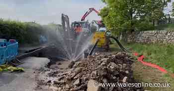 Huge sinkhole suddenly emerges in Welsh road leaving locals without water