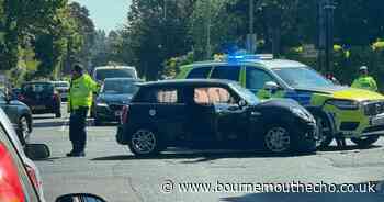 Crash involving police vehicle at Poole junction