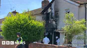 Man arrested after fire leaves three in hospital