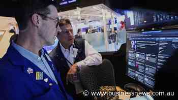 Wall St ends mixed as investors digest data, forecasts