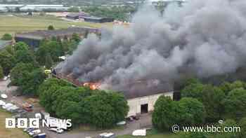 Large fire at historic motoring and aviation site