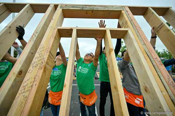 OC business leaders put down their briefcases for a day building Habitat for Humanity homes