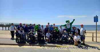 Fundraisers walk to pier and back to raise money for children's bus