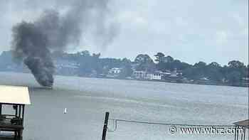 Pier, boat on fire along False River