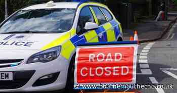 LIVE: Road closed while officers negotiate with woman