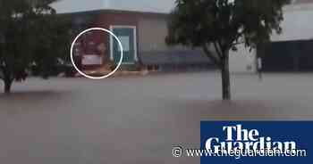 'Give these blokes the clothes off my back': Taree man films SES flood rescue – video