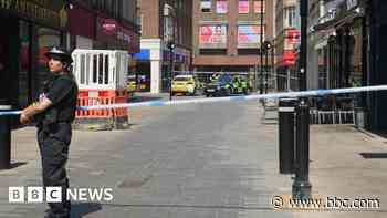 Three in court over stabbing in shopping street