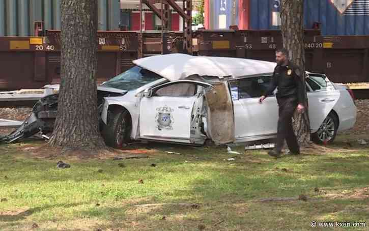 Funeral home limo driver, escorts cited in train collision that 'mangled' car