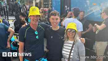 Cyclist celebrates Tour de France finish