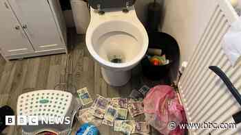 Suspects flush cash down toilets as police raid them