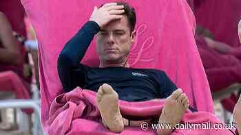 Under-fire Burnley boss Scott Parker escapes stress of impending relegation as he takes Barbados beach break alongside wife Carly