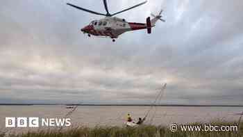 Pair winched to safety from listing sailing boat