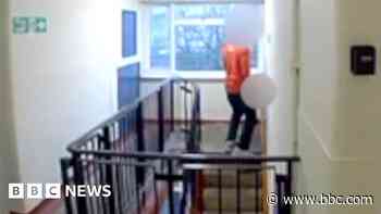 'Postman' caught on camera urinating in doorway