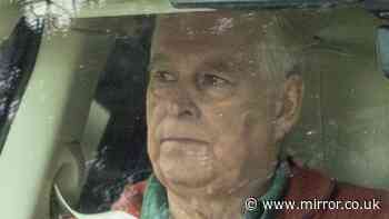Shamed Andrew looks stony-faced as he spotted driving around Sandringham