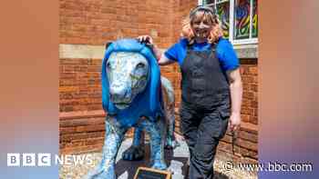 Artist's delight as lion statue 'comes home'