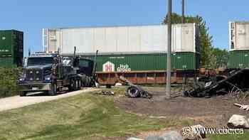 Truck driver seriously hurt after collision with freight train east of London