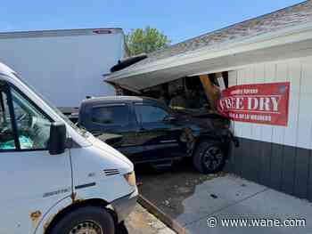 Six people hurt after semi crashes into laundromat on West Jefferson