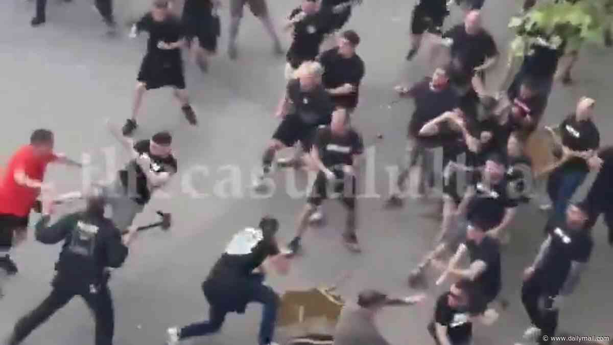 Crystal Palace fans clash with rival supporters in violent scenes as riot police step in ahead of Conference League final in Germany