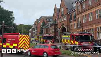 Crews attend fire at town centre block of flats