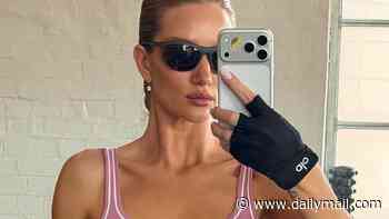 Rosie Huntington-Whiteley shows off her toned abs in pink Alo athleisure wear as she hits the gym