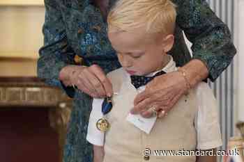 Seriously ill boy gets Queen to present his bravery medal from Scouts