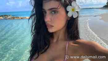 Kylie Jenner sizzles in a tiny bikini as she continues her Turks and Caicos getaway... a year after admitting she got breast implants